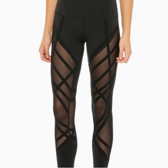 Alo Yoga High-Waist Wrapped Stirrup Legging in black with mesh panels. - Picture 4 of 7